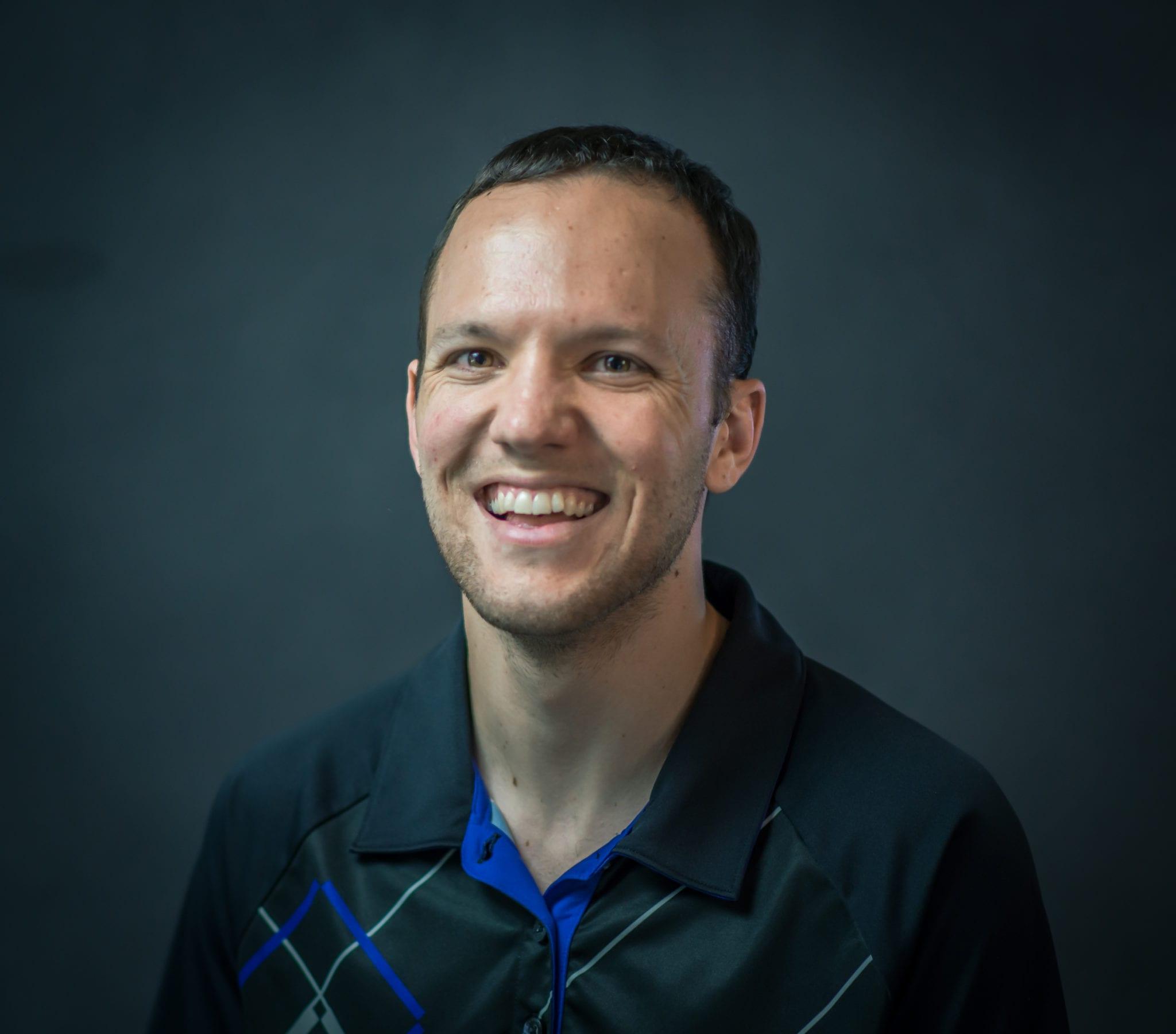 Headshot of James Sweeney